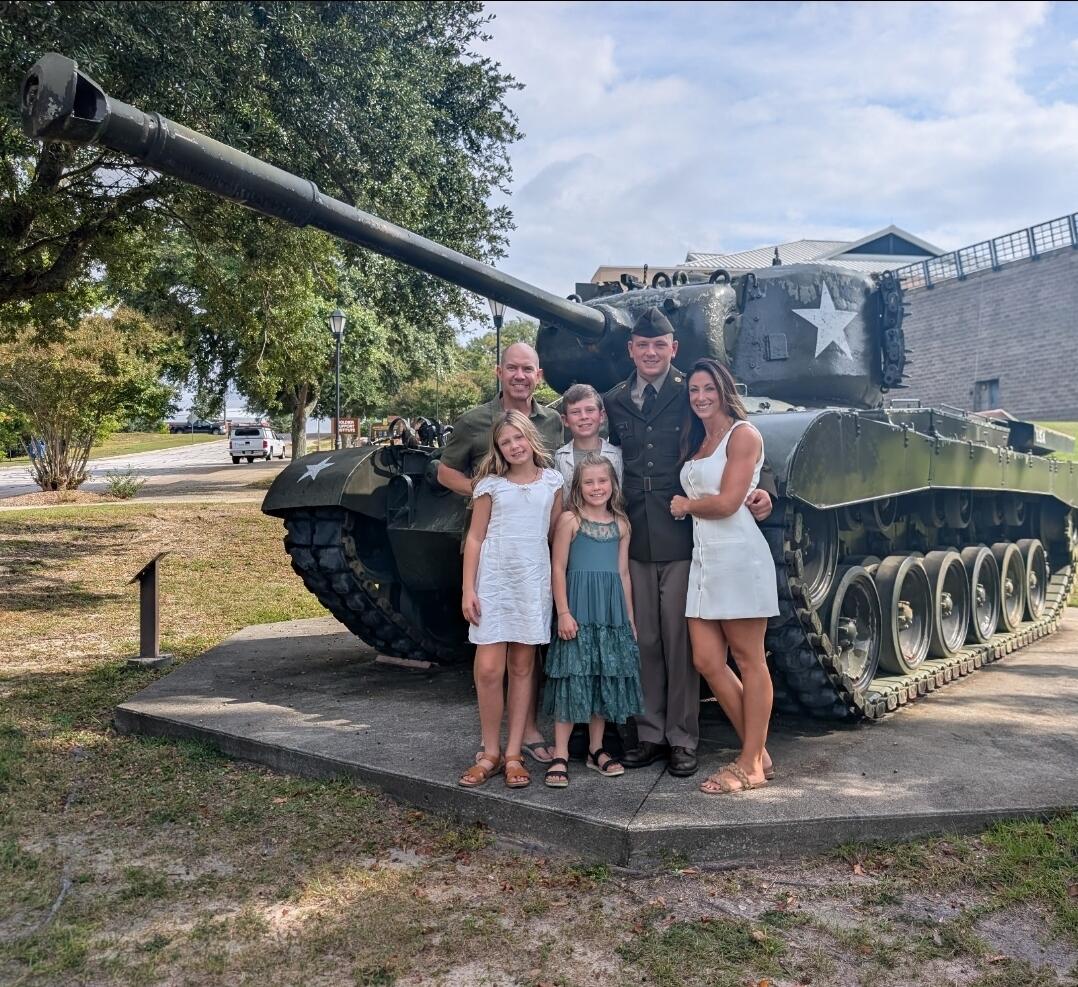 Thomas family with Brandson in military uniform