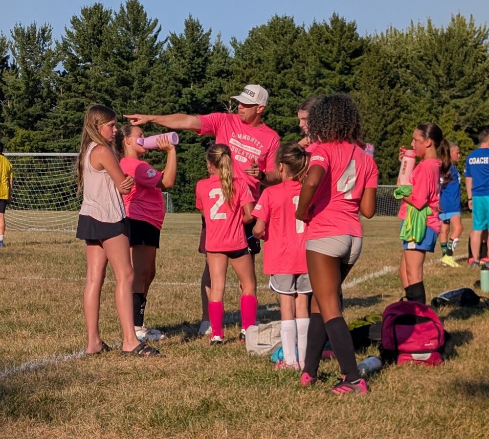 Sean Thomas coaching girls soccer with Community Education