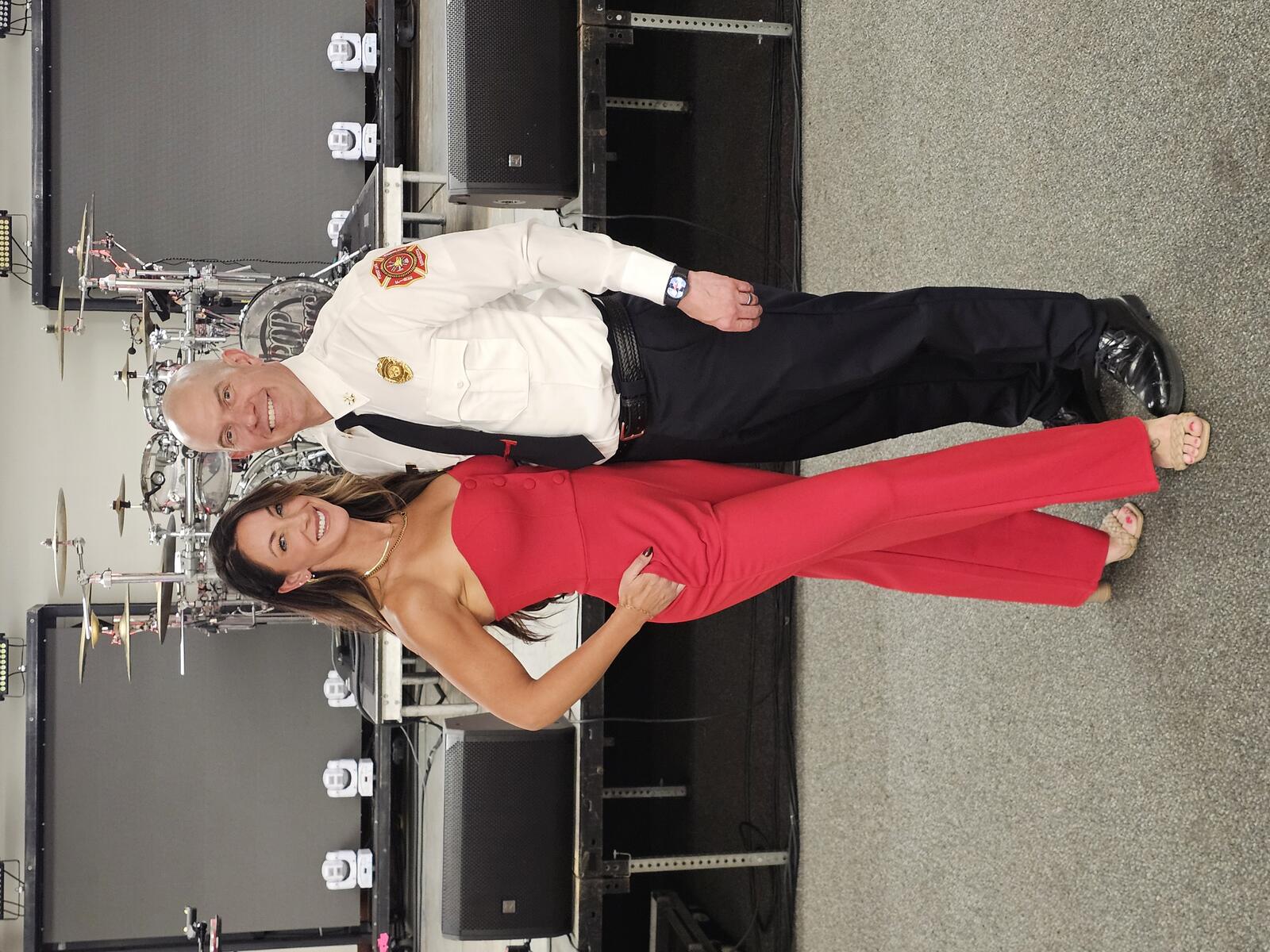 Sean Thomas in Forest Lake Fire Department uniform with his wife Alyssa